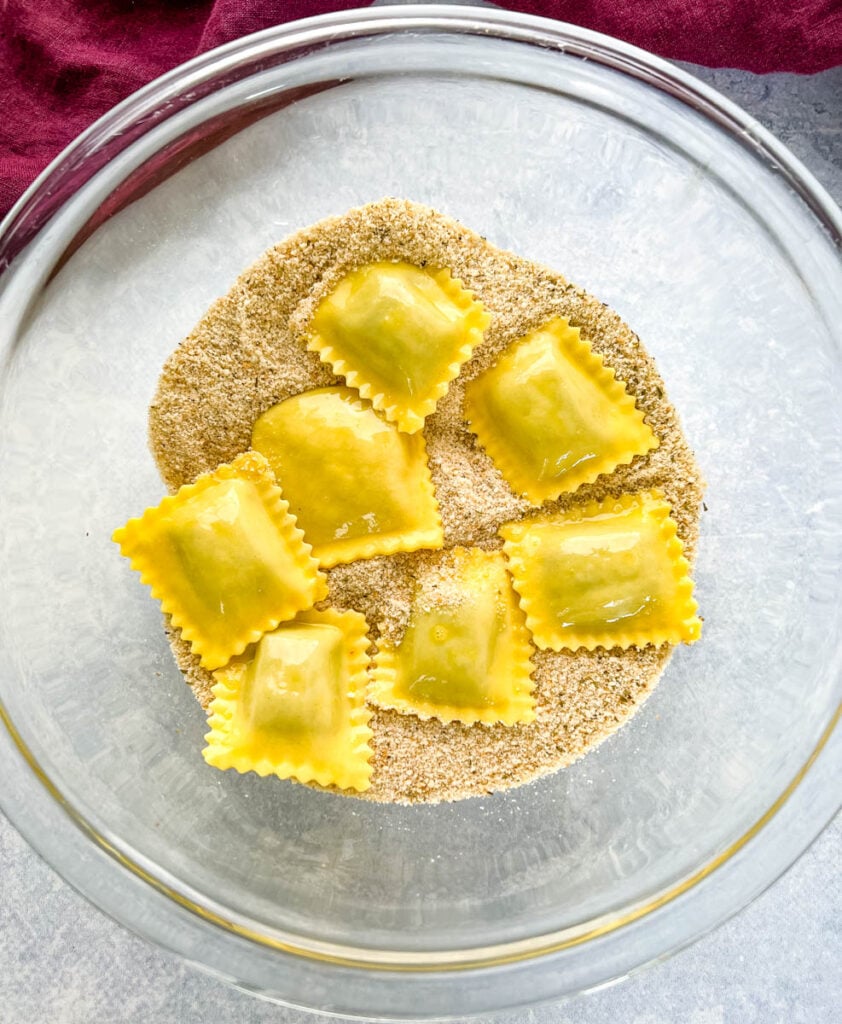 ravioli coated in breadcrumbs and eggs