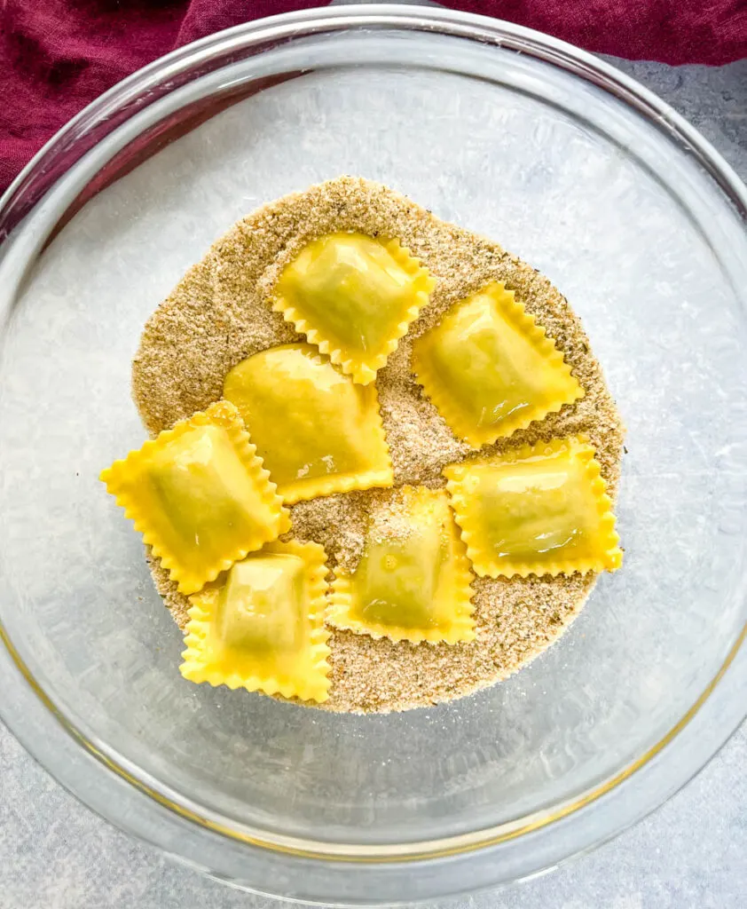 ravioli coated in breadcrumbs and eggs