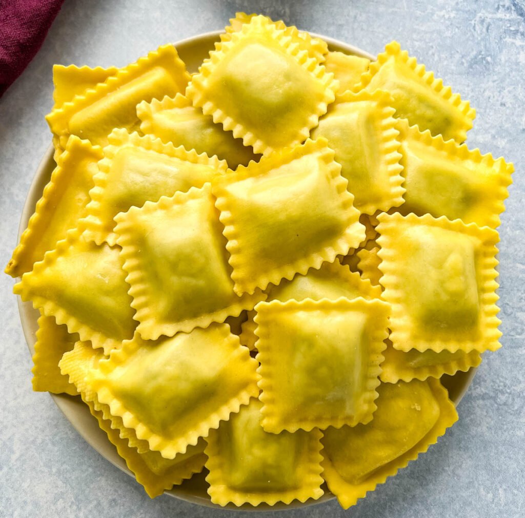 uncooked ravioli on a plate