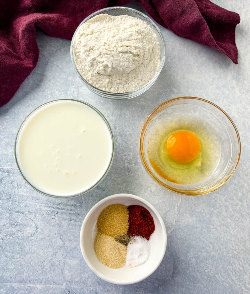 flour, buttermilk, egg, and spices in separate bowls