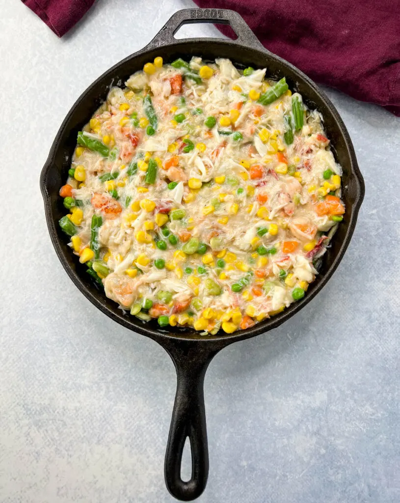 unbaked seafood pot pie in a cast iron