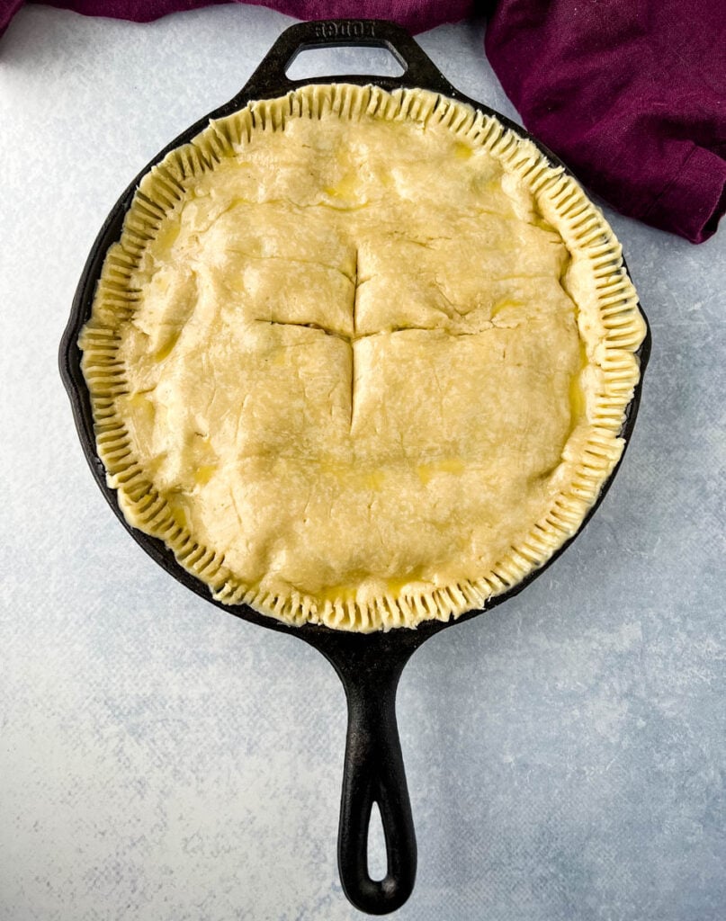 unbaked seafood pot pie in a cast iron