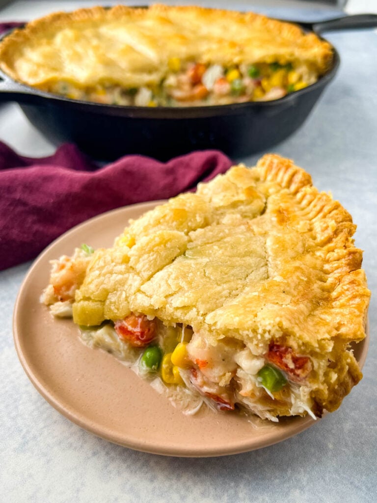 seafood pot pie on a pink plate