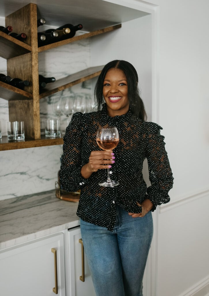 Brandi Crawford holding a wine glass