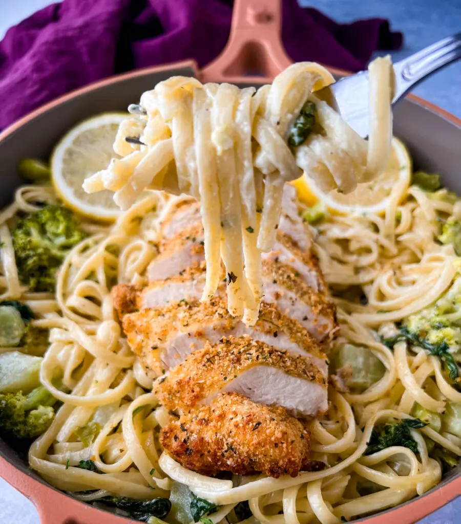 a fork filled with lemon pasta