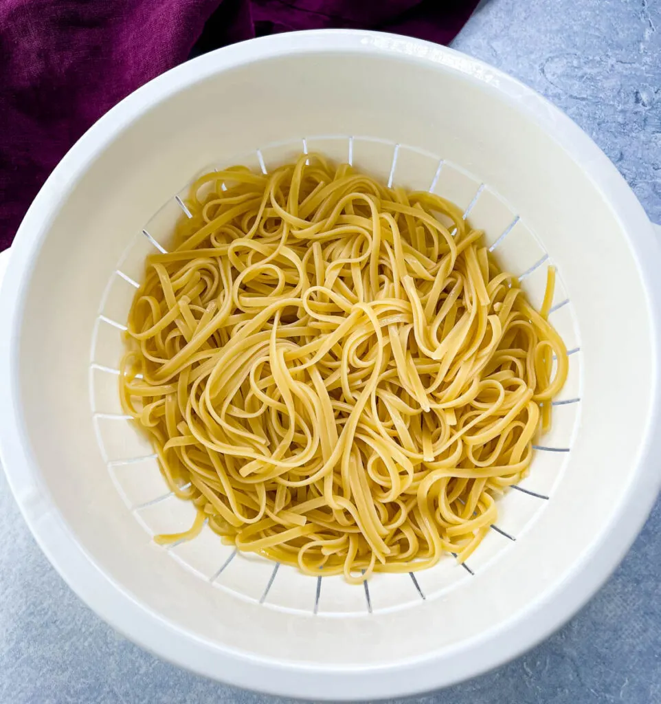 cooked fettuccine in a colander