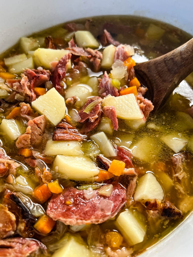 slow cooker ham and potato soup in a Crockpot with vegetables