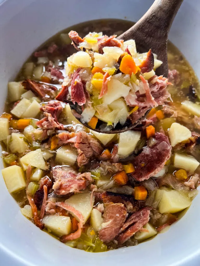slow cooker ham and potato soup in a Crockpot with vegetables