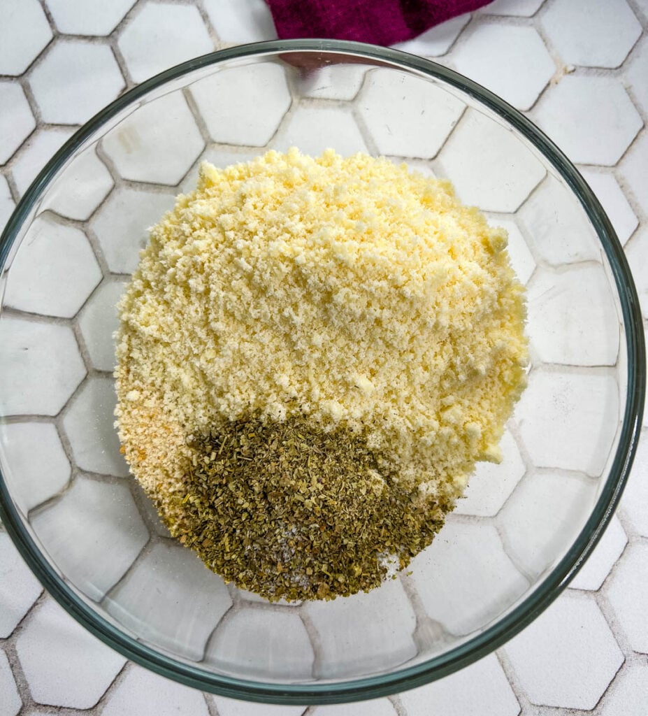 breadcrumbs and parmesan cheese in a glass bowl