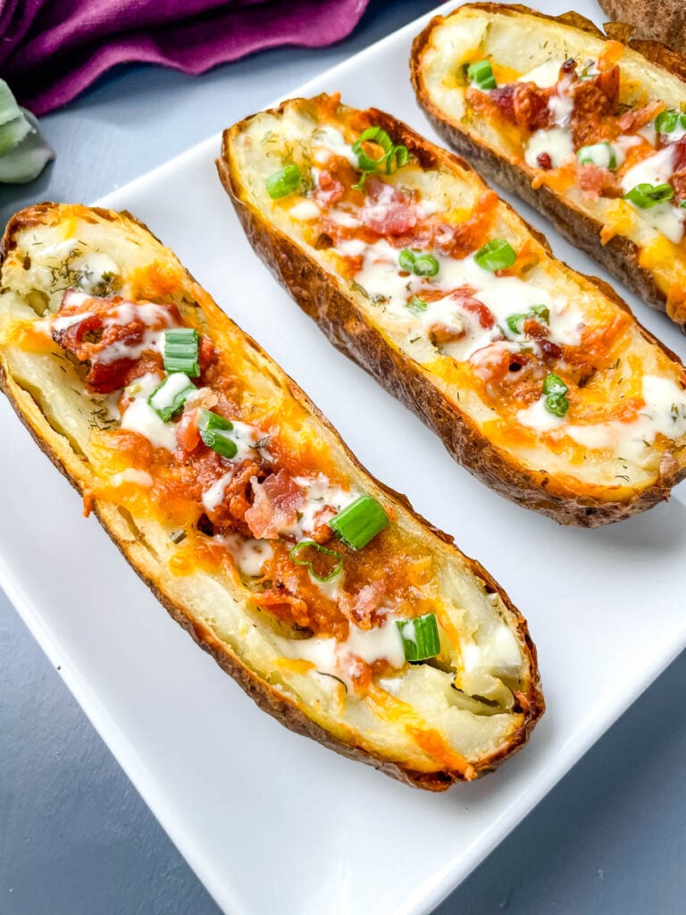 air fryer potato skins on a plate with bacon