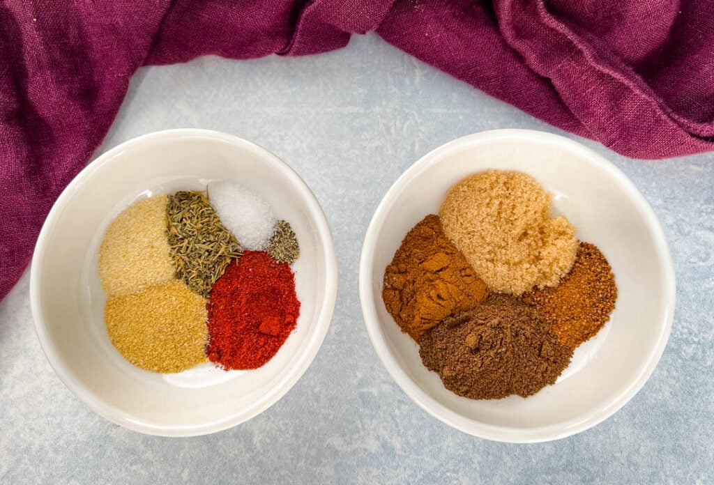 spices for jerk seasoning and rub in separate white bowls