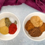 spices for jerk seasoning and rub in separate white bowls