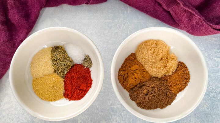 spices for jerk seasoning and rub in separate white bowls