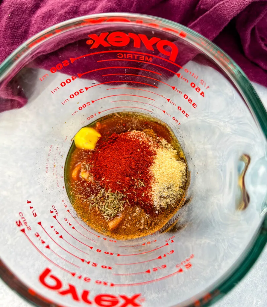 jerk marinade in a glass measuring cup