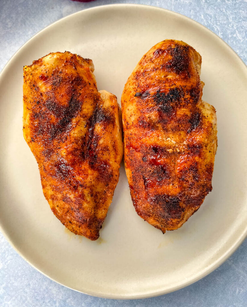 cooked chicken breasts on a plate