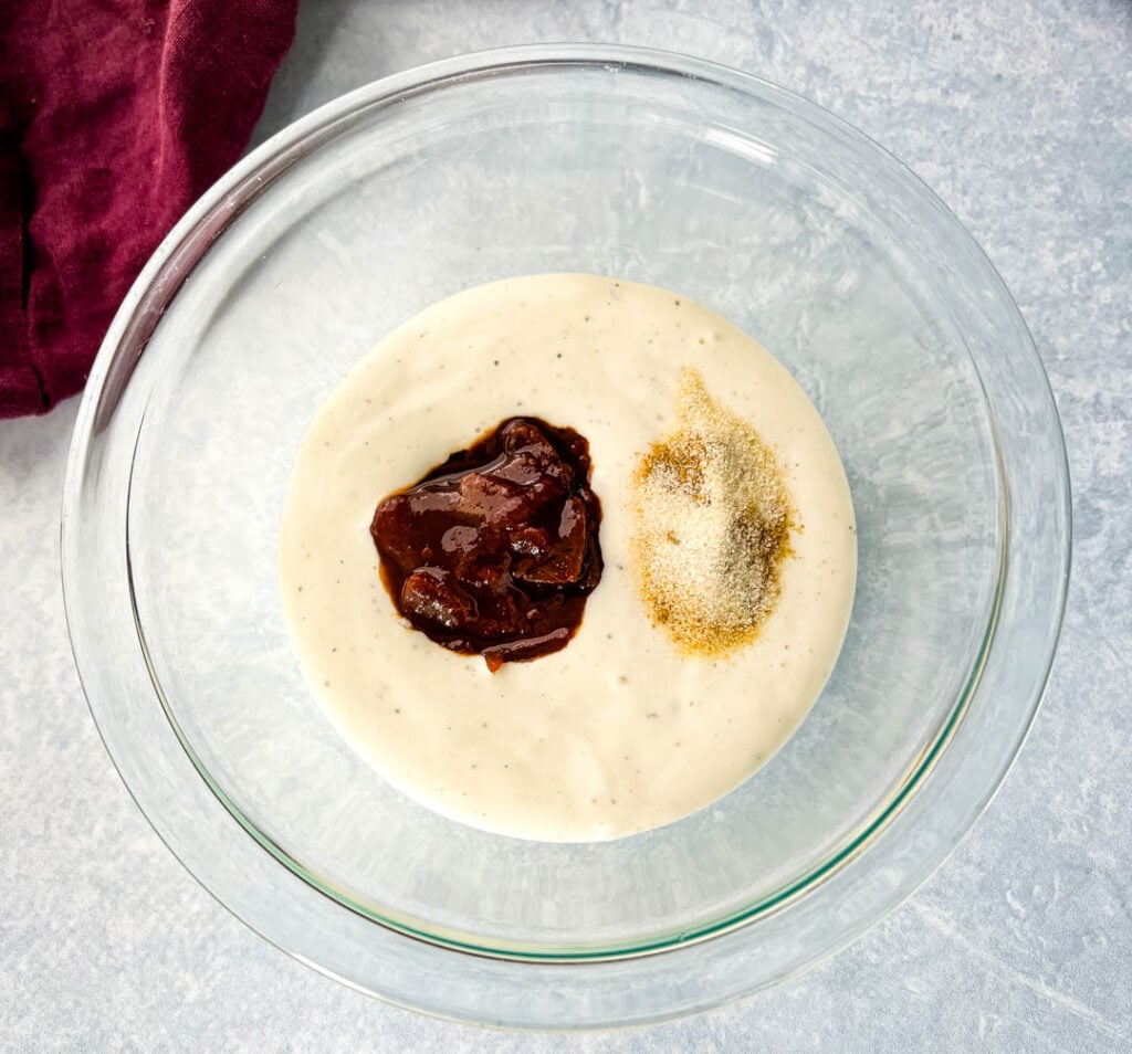 ranch, chipotles in adobo sauce, and spices in a glass bowl