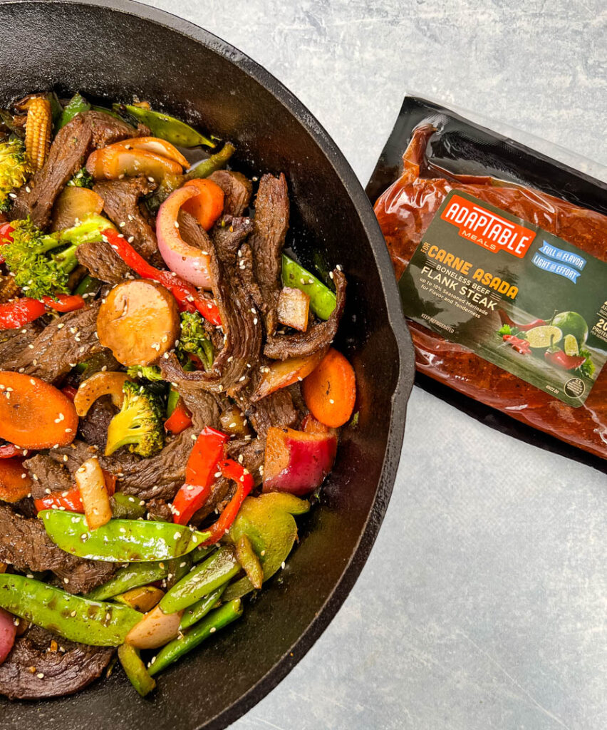 steak stir fry in a cast iron skillet