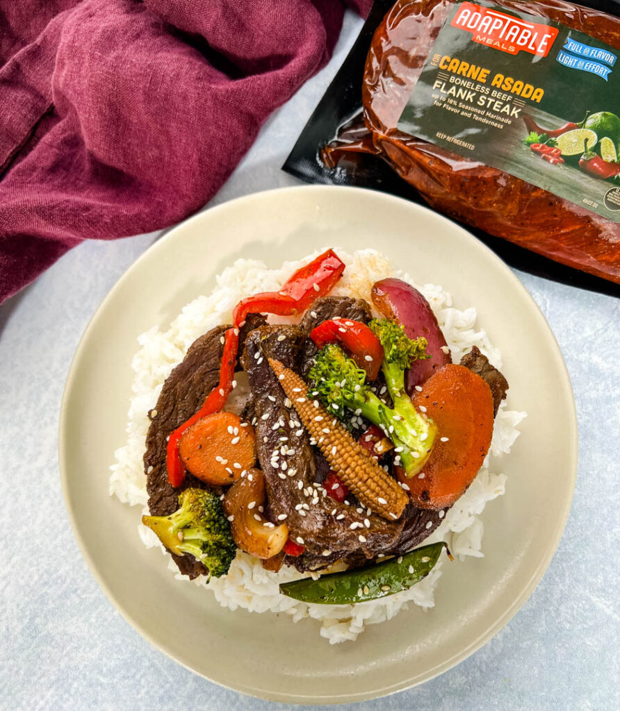 steak stir fry on a plate with vegetables