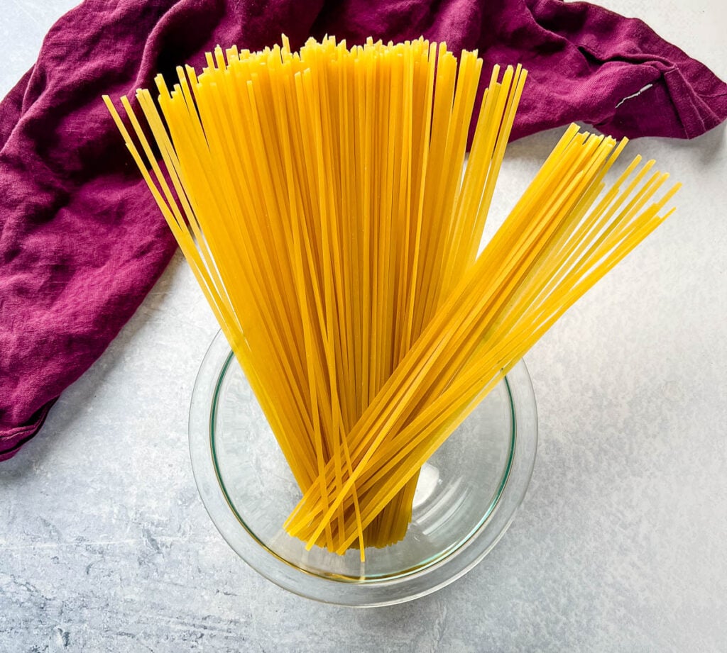 uncooked pasta in a glass bowl