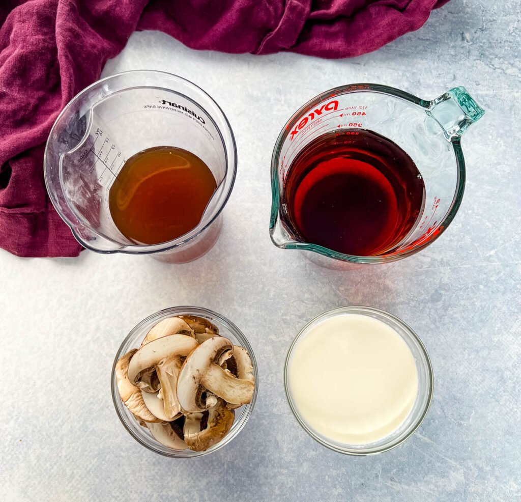 beef broth, Madeira wine, mushrooms, and heavy cream in glass bowls