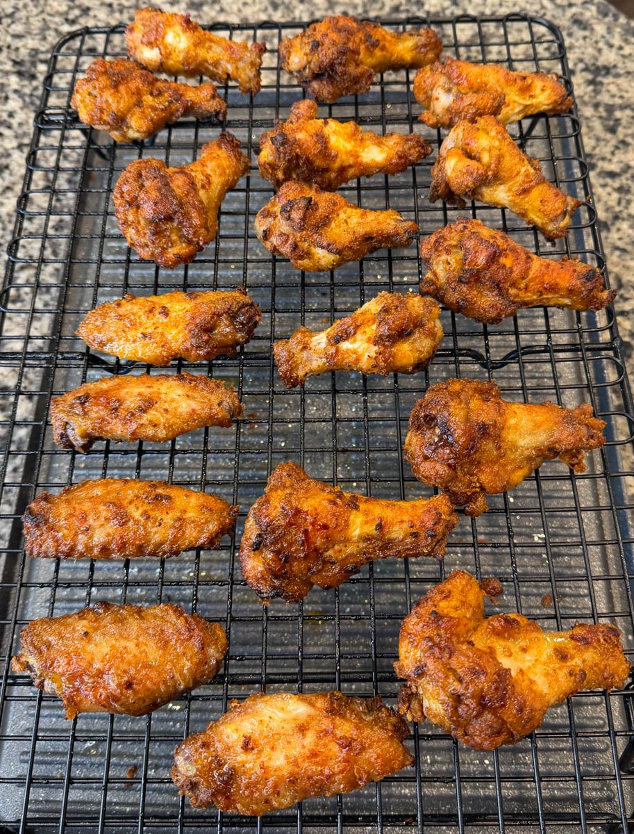 dry rub wings on a baking rack