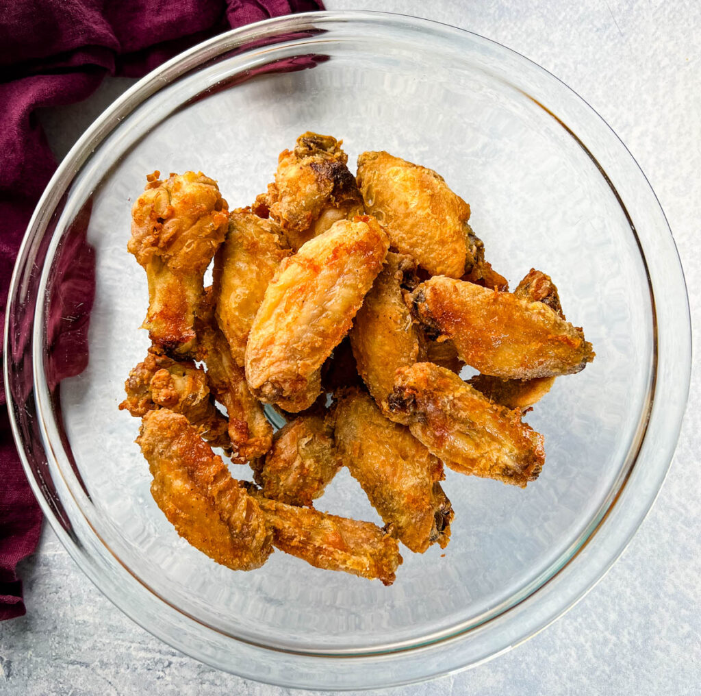 fried or baked wings in a glass bowl