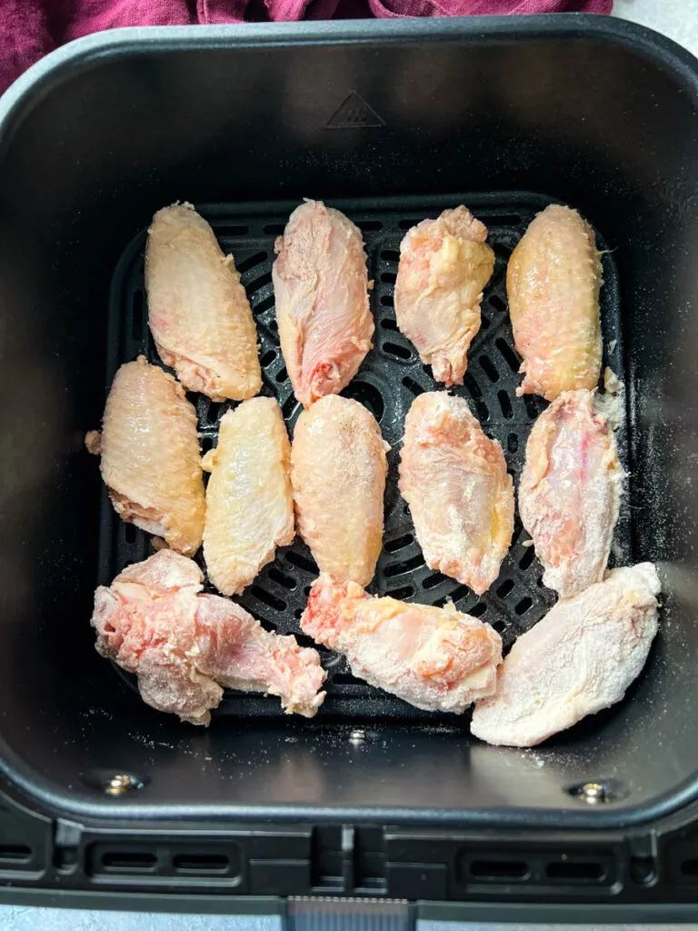 raw chicken wings in an air fryer