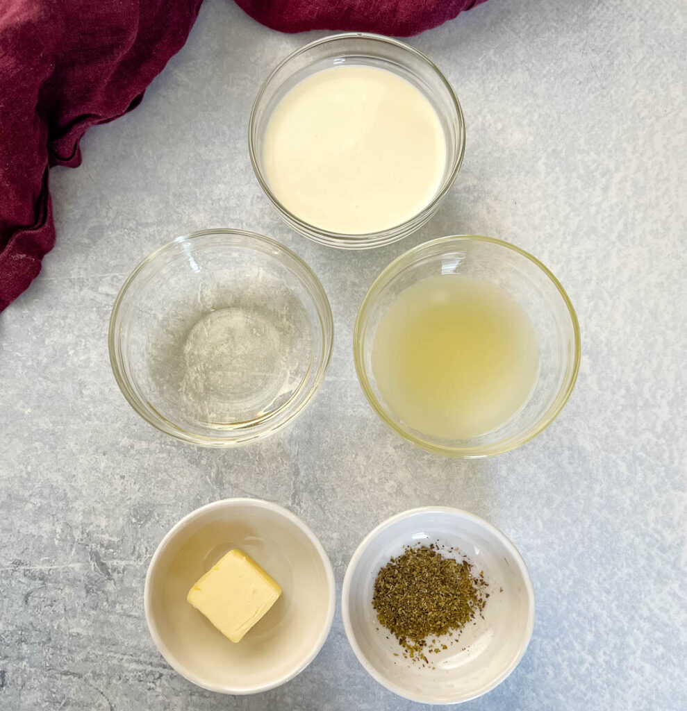 heavy cream, broth, butter, white wine, and Italian seasoning in separate bowls