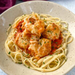 shrimp parmesan Parmigiana with mozzarella and pasta in a bowl