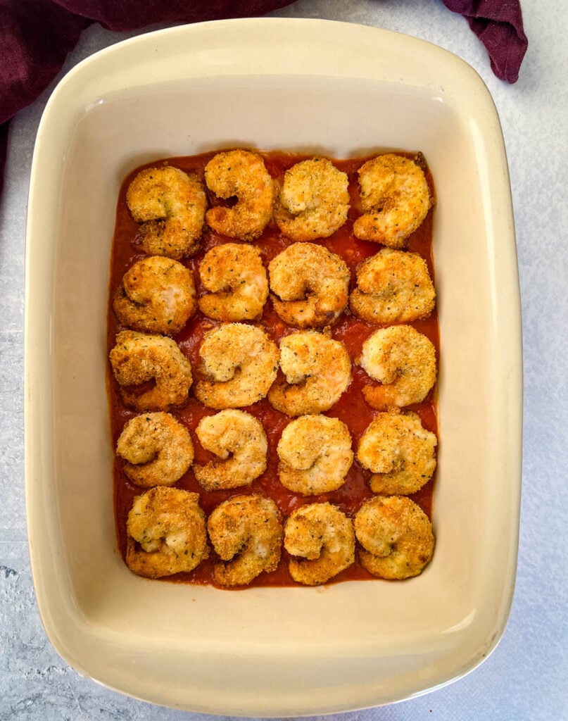 shrimp parmesan Parmigiana in a baking dish