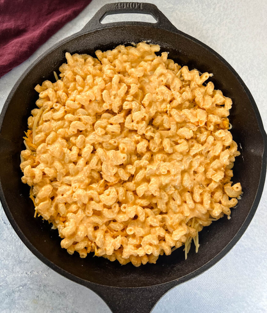 uncooked smoked mac and cheese in a cast iron skillet