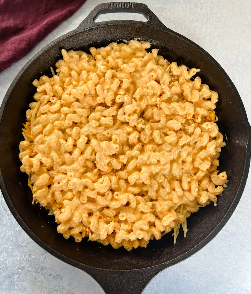 uncooked smoked mac and cheese in a cast iron skillet