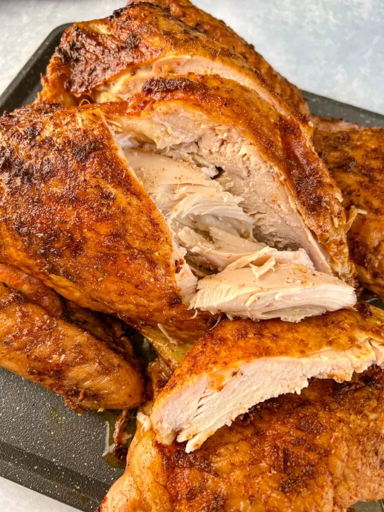 smoked turkey breast sliced on a flat surface