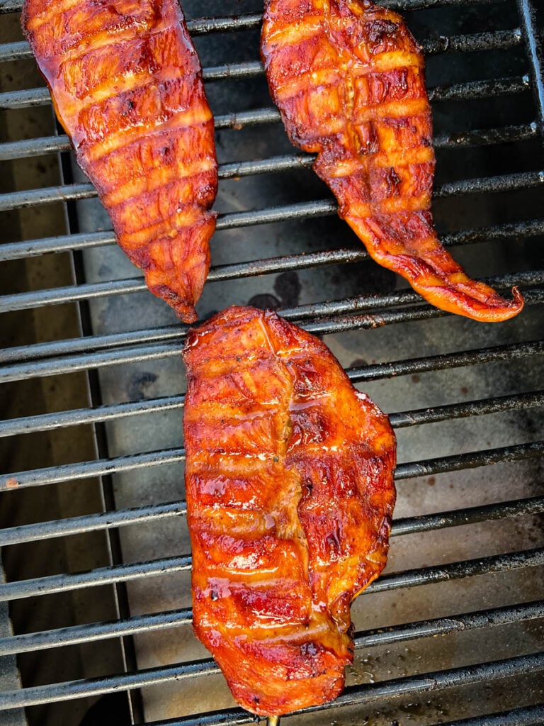 chicken breasts on a Traeger smoker grill