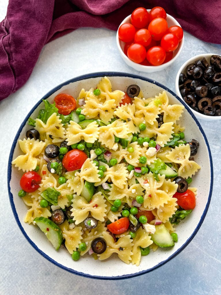bow tie farfalle pasta salad with vegetables with Italian dressing in a bowl