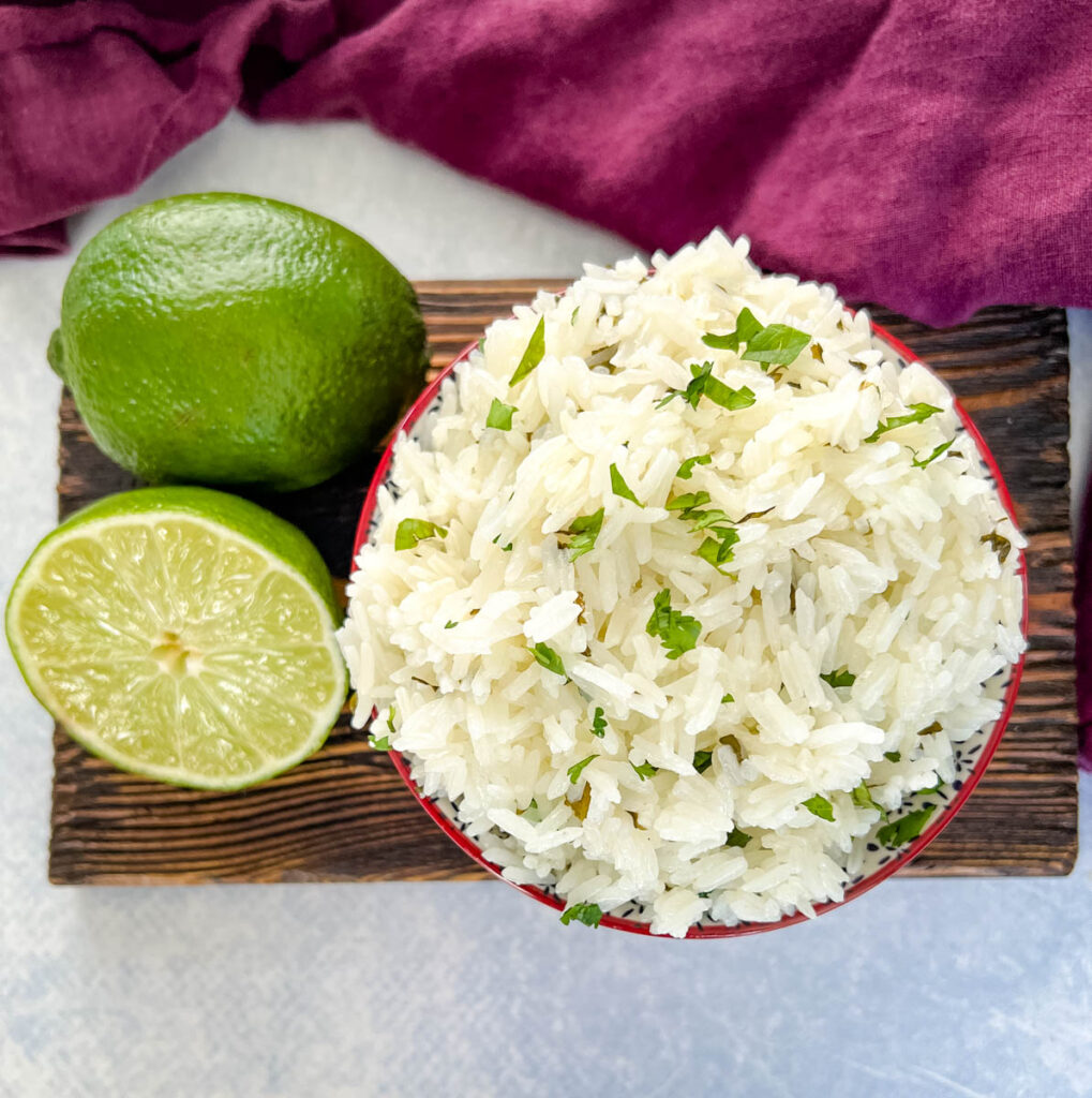 Chipotle cilantro lime rice in a bowl with fresh limes