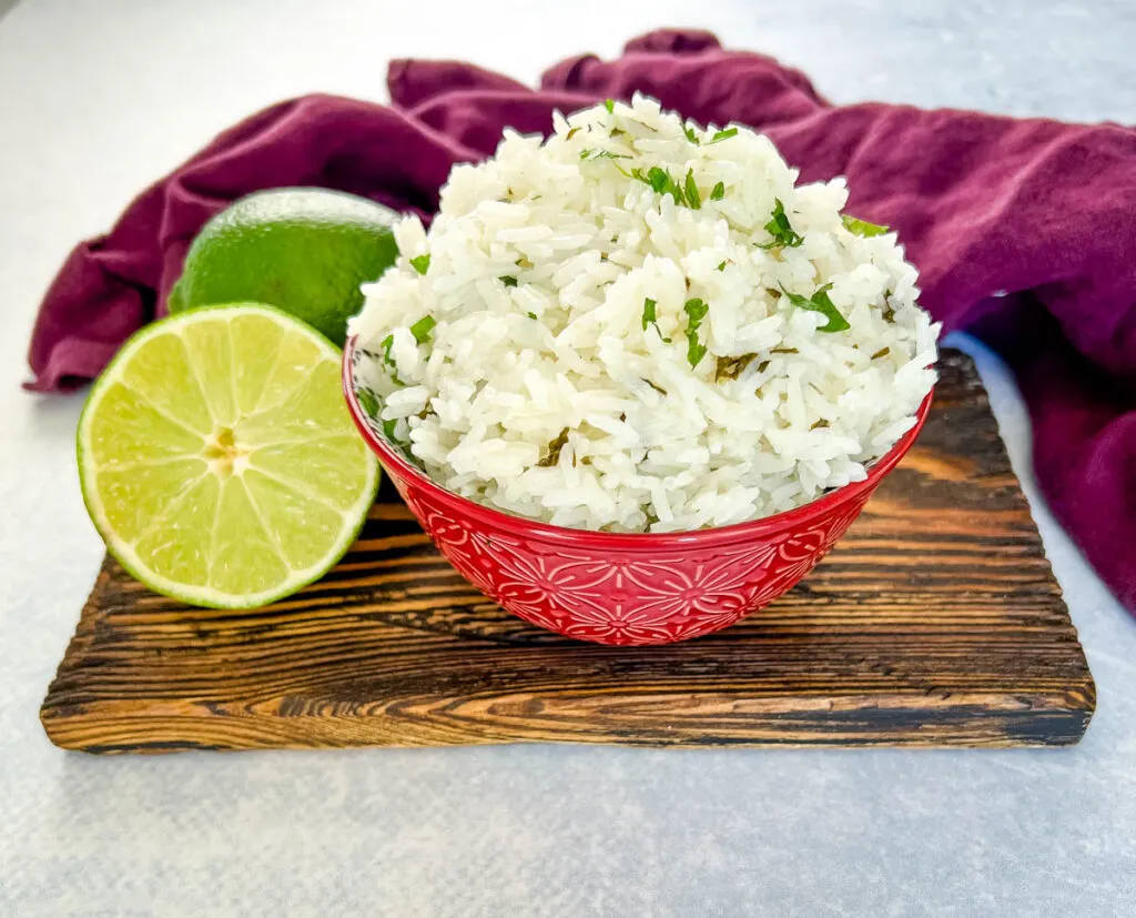 Chipotle cilantro lime rice in a bowl with fresh limes