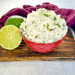 Chipotle cilantro lime rice in a bowl with fresh limes