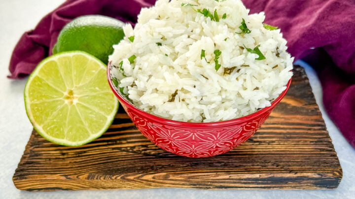 Chipotle cilantro lime rice in a bowl with fresh limes