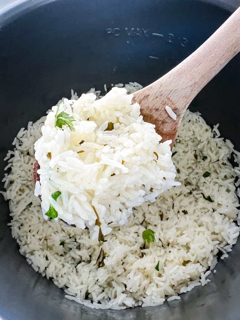 a wooden spoonful of Chipotle cilantro lime rice