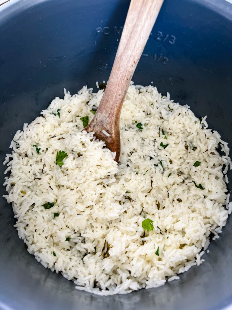 a wooden spoonful of Chipotle cilantro lime rice