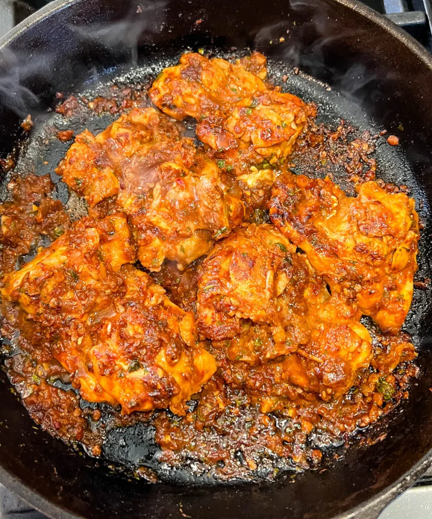 pollo asado in a cast iron skillet