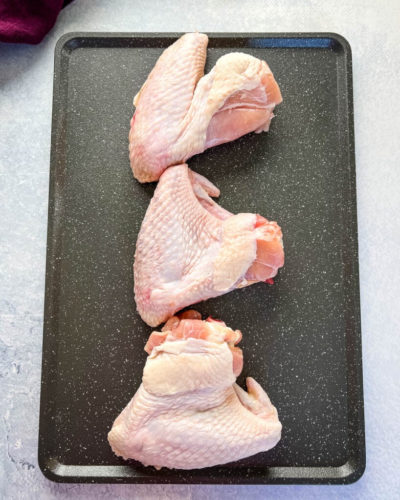 raw whole turkey wings on a pan