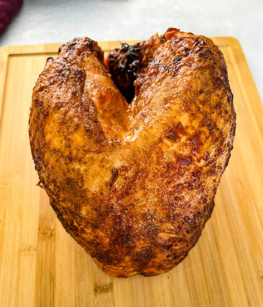 smoked turkey breast on a cutting board