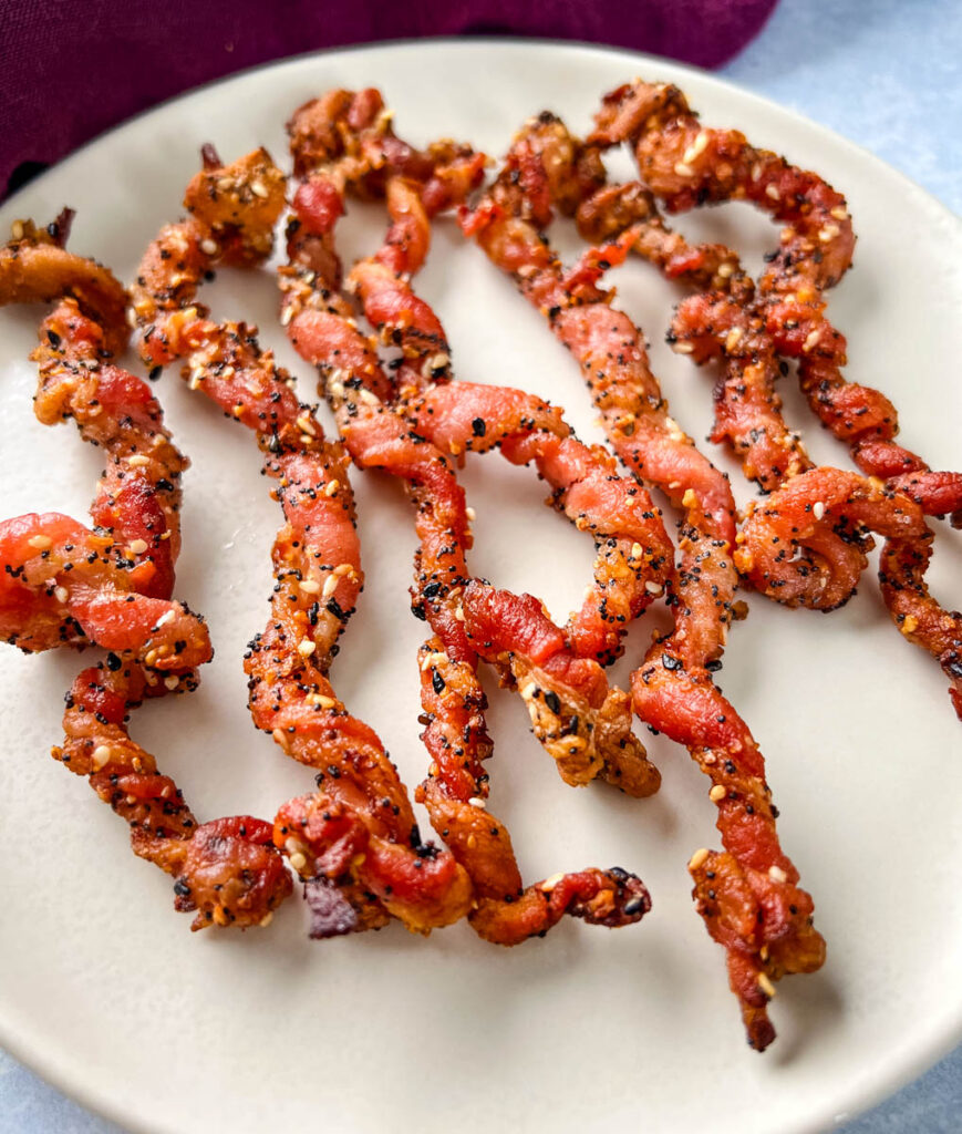 cooked twisted bacon on a plate