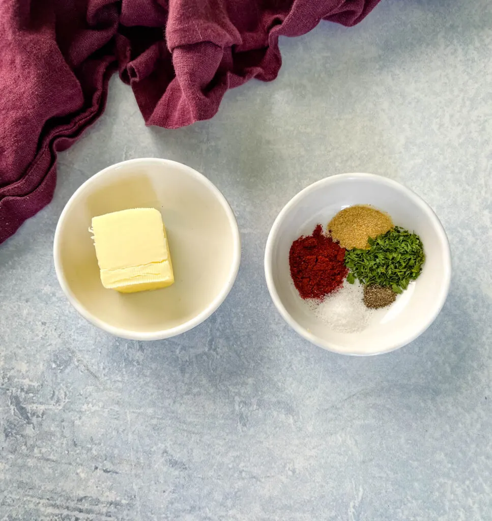 butter and spices in separate white bowls