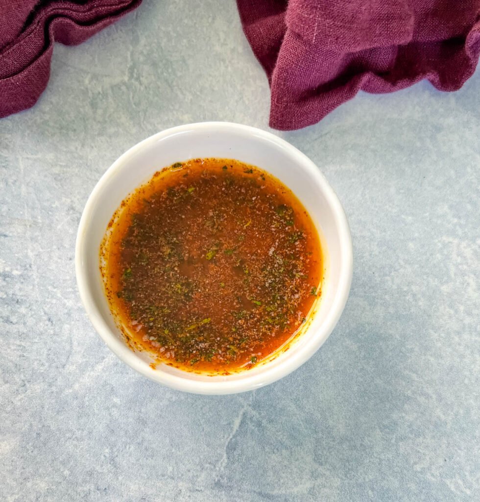 garlic butter sauce in a white bowl