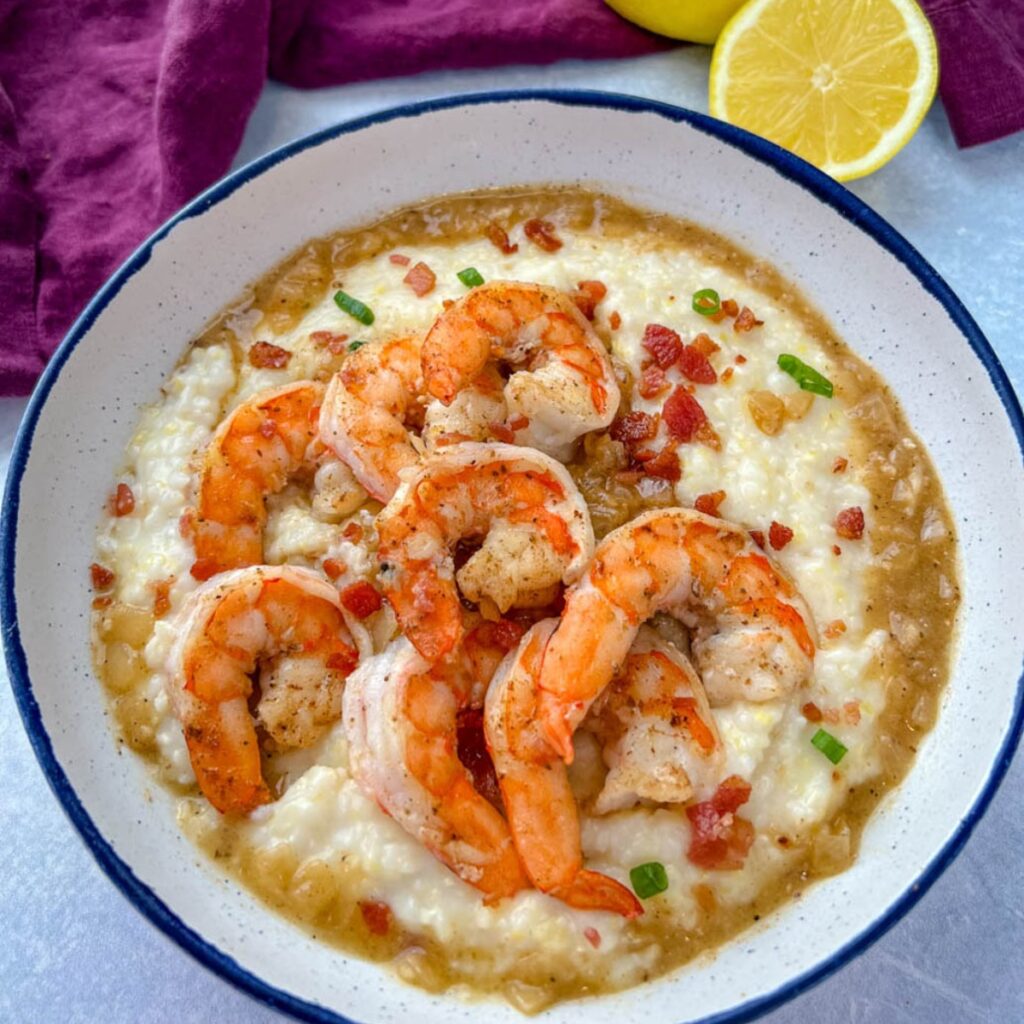 shrimp, gravy, and grits in a white bowl