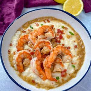 shrimp, gravy, and grits in a white bowl