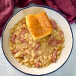 Southern butter lima beans in a bowl with cornbread